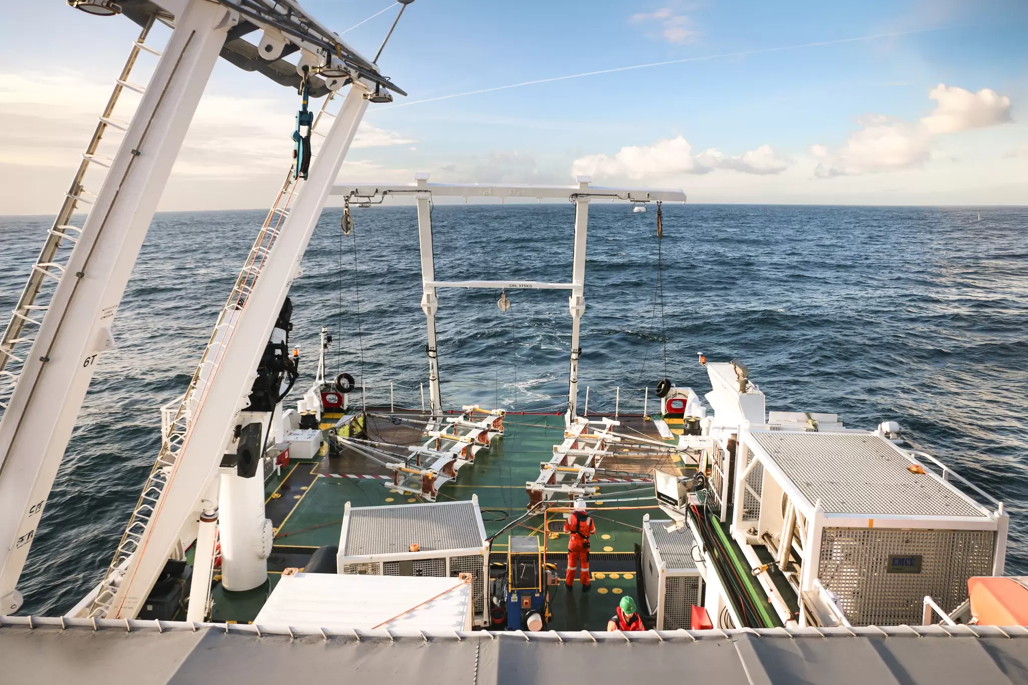Deploying geophysical equipment from back deck of vessel.jpg