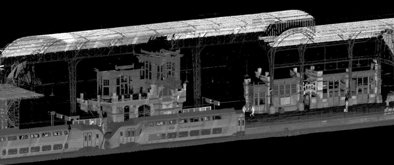 Black and white mapping model of train station in The Nethrlands with a double decker train leaving the station
