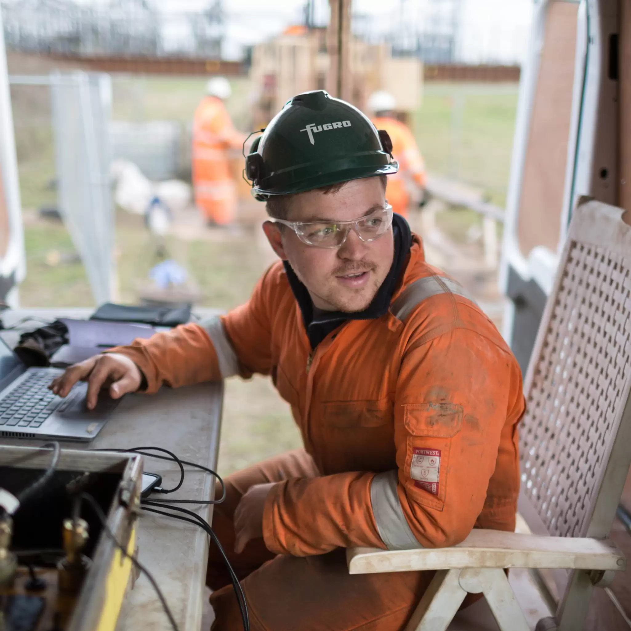 Engineer operating machinery inside van 09.jpg
