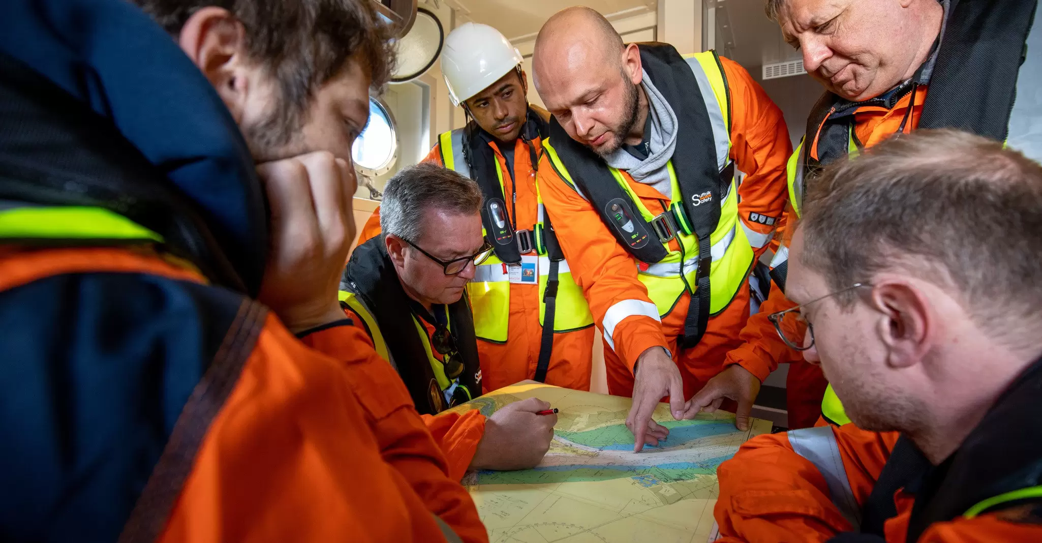 Fugro employees reviewing a nautical chart 05.jpg