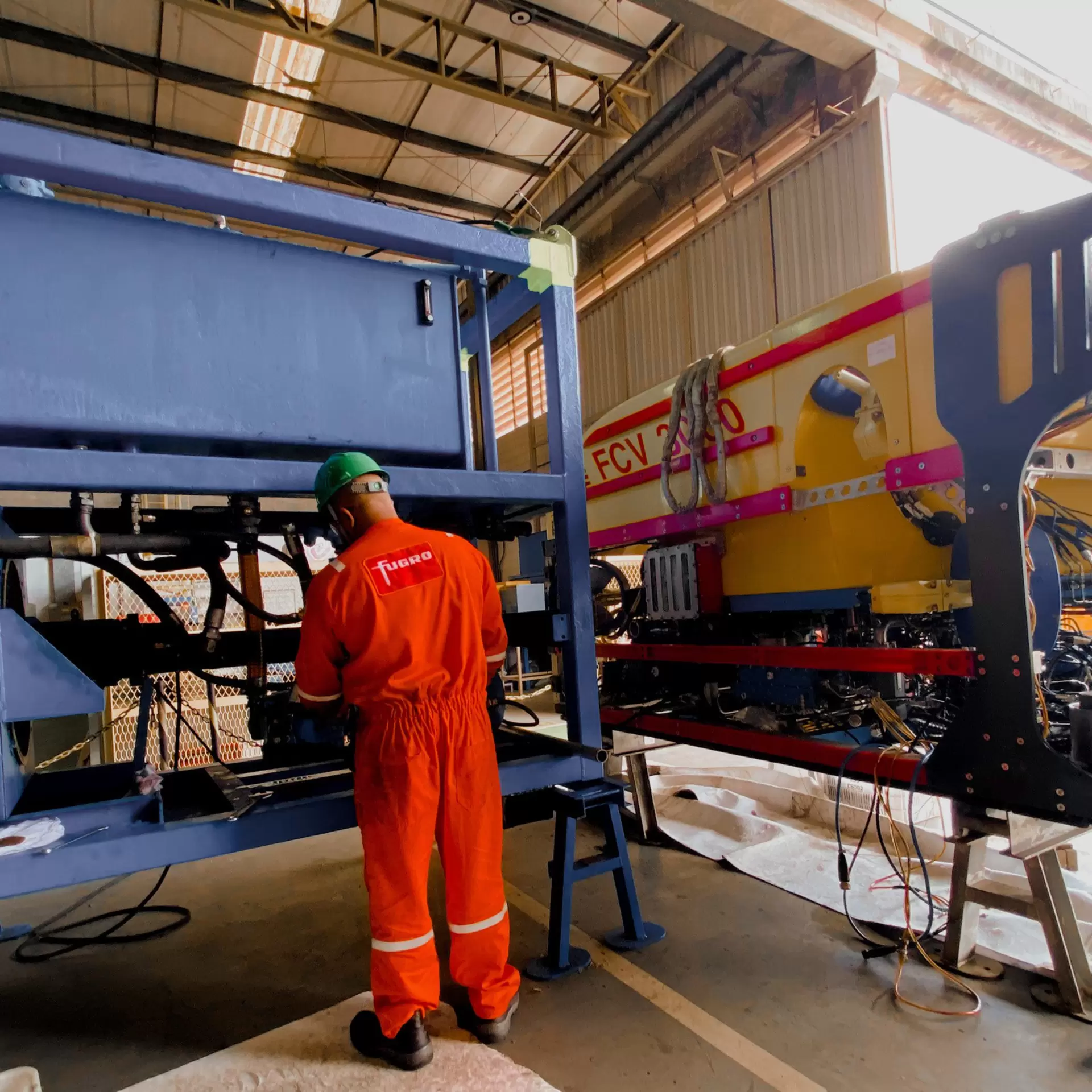 Employee performing maintenance on ROV, Brazil.jpg