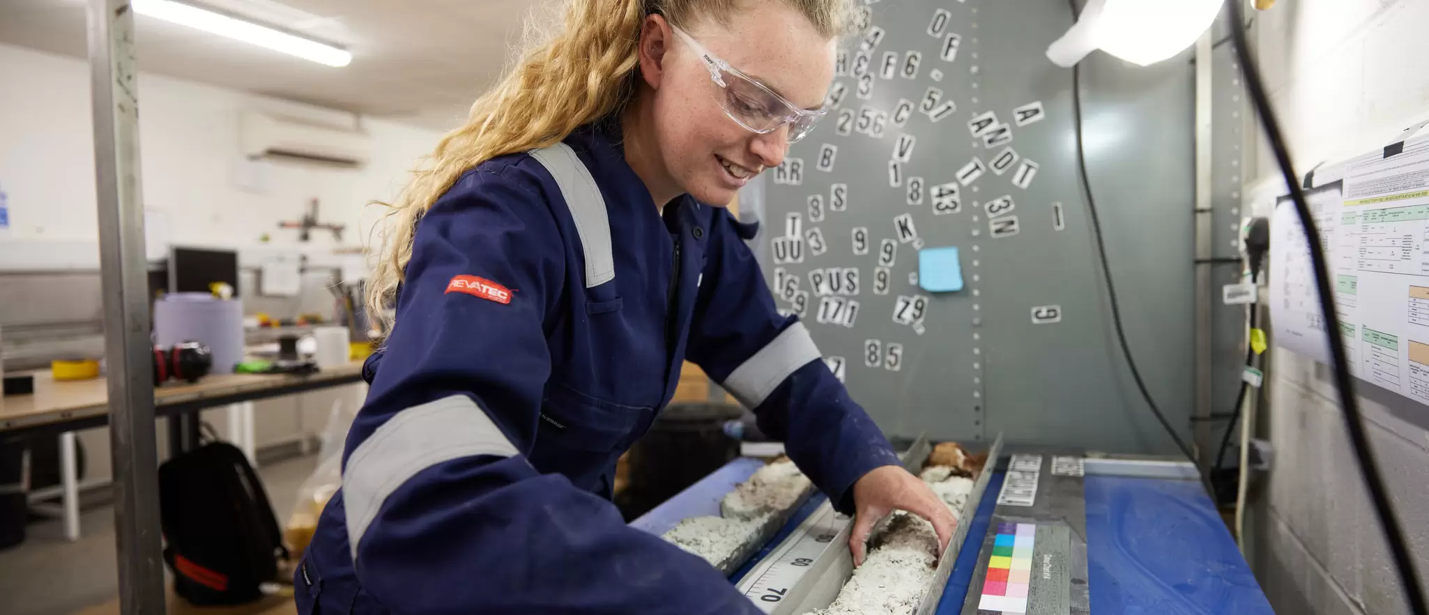 Employee preparing sample for core logging 08.jpg