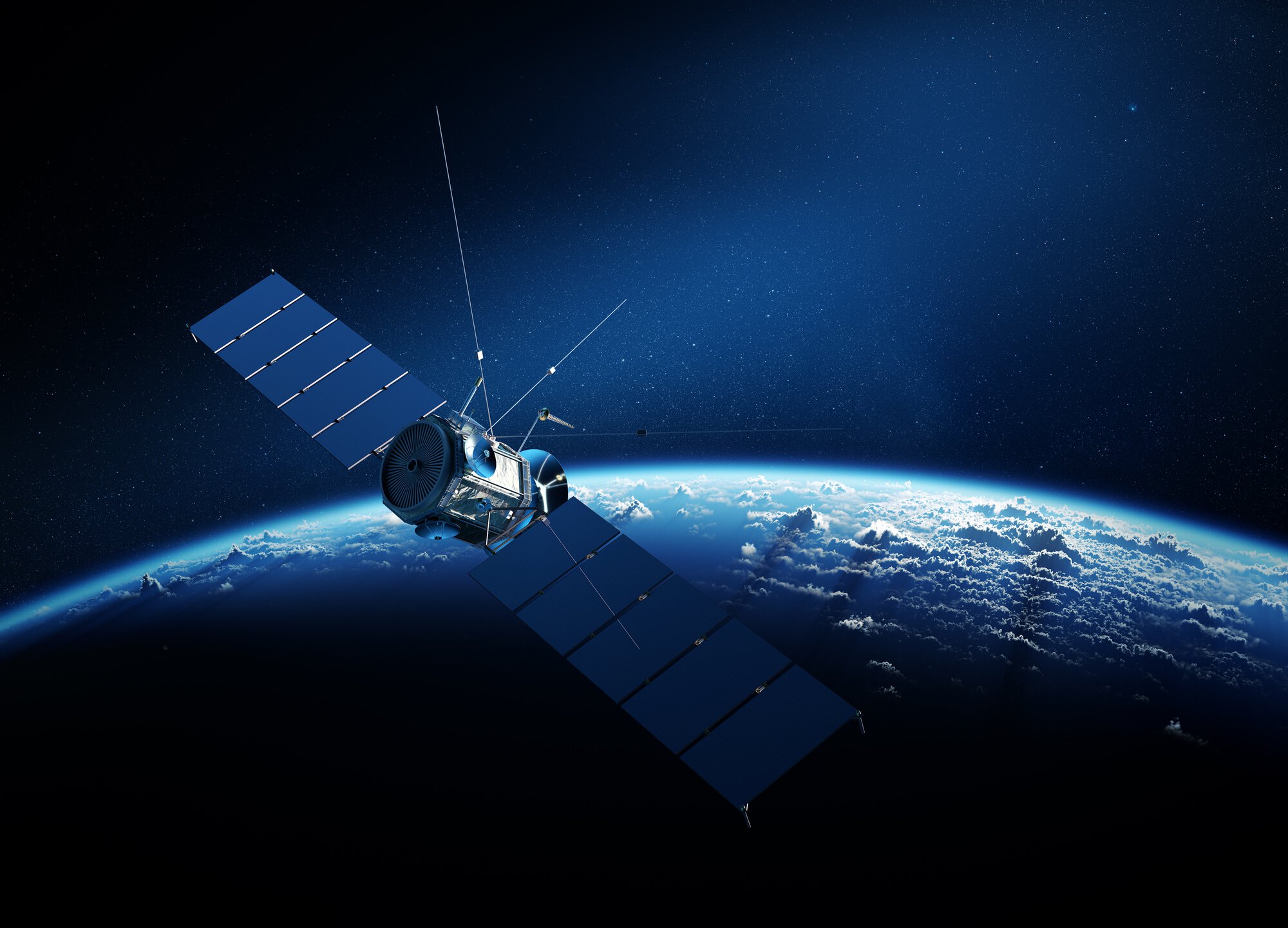 Communications satellite orbiting Earth with sunrise in space
494562740