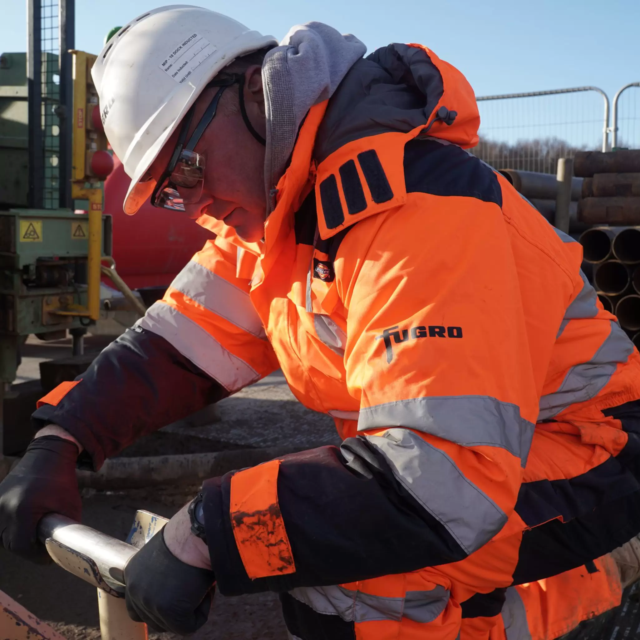 Employee working on wireline geophysics logging unit 23.JPG
