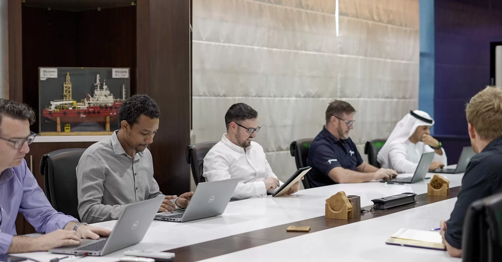 Employees having meeting in Abu Dhabi office 01.jpg